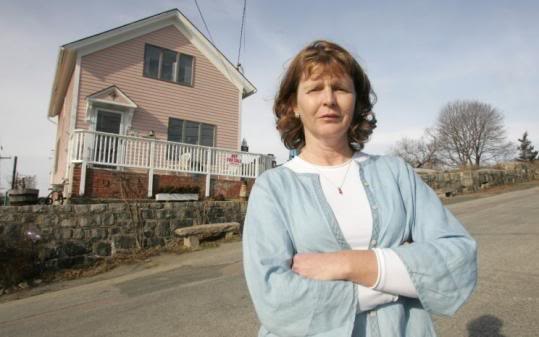 Susette Kelo in front of her home